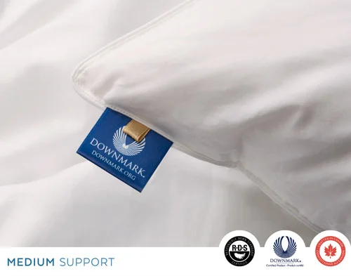 Close-up of the DOWNMARK® Certification tag on the edge of our Opula Down Pillow.