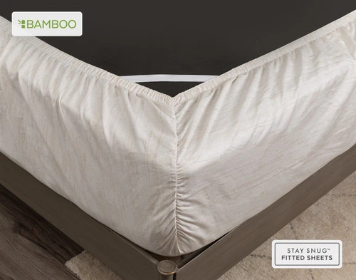 Coin de matelas retourné enveloppé dans notre housse Crosshatch Bamboo Cotton drap  ensemble 's fitted drap pour montrer qu'il est bien ajusté.