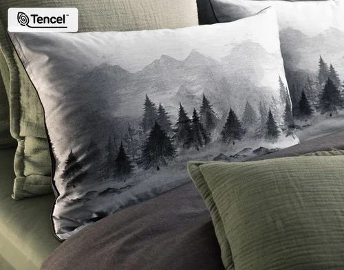 Our Plateau Pillow Shams dressing the head of a bed with green accessories.