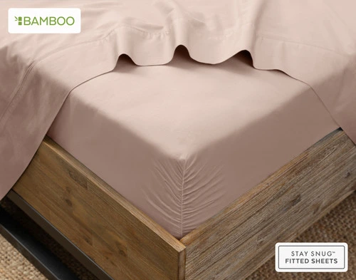 Angled view of our Bamboo Cotton Fitted Sheet in Frosted Berry, a light iced pink, snugly wrapped around a mattress.