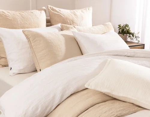 Side, off-centre view of our Chalkstone collection dressing the head of a bed.