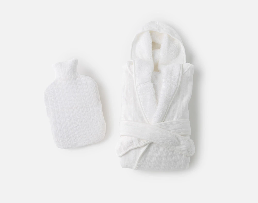 Top view of our Warm Me Up Gift Set in White with its folded White Chenille Sherpa Bathrobe and matching White Chenille Sherpa Hot Water Bottle.