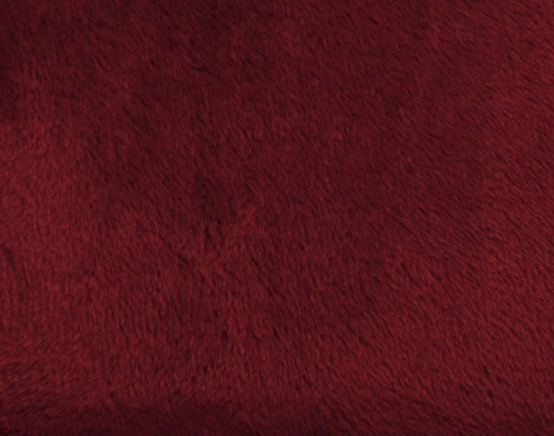 Close-up on our Velvet Plush Throw in Merlot to show its soft velveteen texture.