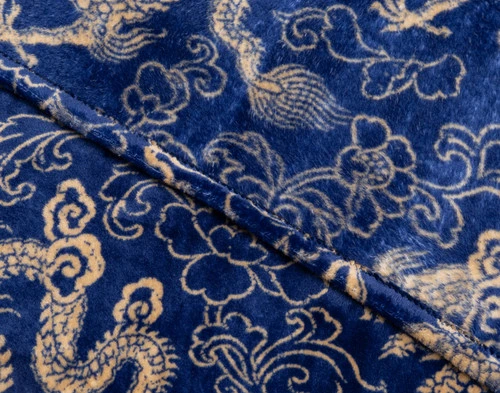 Close-up on the folded edge on our Lucky Dragon Throw in Gold Fortune.