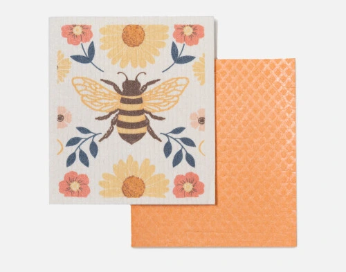 Vue de face de notre ensemble Bee Swedish Dishcloth, comprenant une serviette réutilisable à la main de couleur orange unie et à motifs.