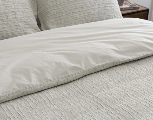 Closer view of the tidily folded top edge of our Montego Duvet Cover with its reverse side showing.