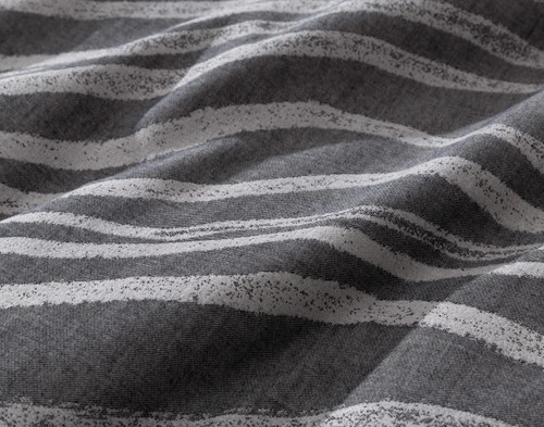 Close-up view of the waving stripes on the surface of our Cavalo Duvet Cover.