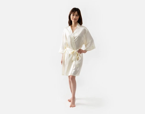 Our Snow Silk Kimono Robe being worn by a young woman with a slim build.