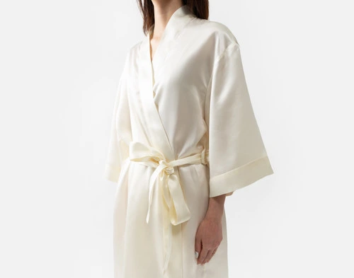 Front view of our Snow Silk Kimono Robe being worn by a young woman.