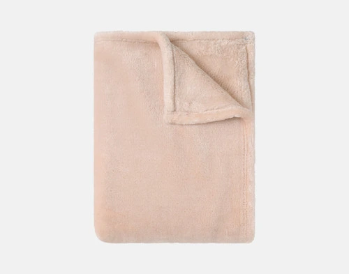 Our Velvet Plush Throw in Rose folded neatly into a tidy square.