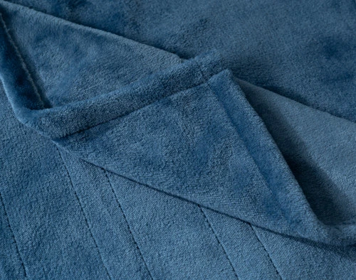 Close-up of the folded corner on our Teal Blue Plush Electric Heated Throw.