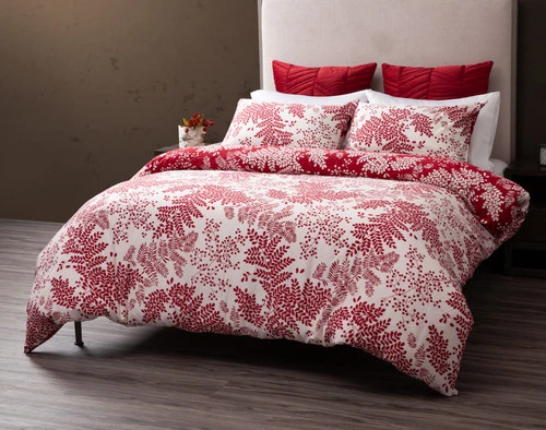 Front view of our Hayberry Duvet Cover over a plain queen bed, showcasing its red foliage design over a solid white background.