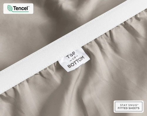 Close-up of Top & Bottom tag on the elastic of our BeechBliss TENCEL™ Modal Fitted Sheet in Grey Oak.