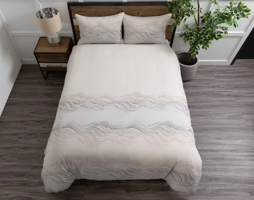 Top view of our Striation Duvet Cover to show its patterned foot end and solid top half.