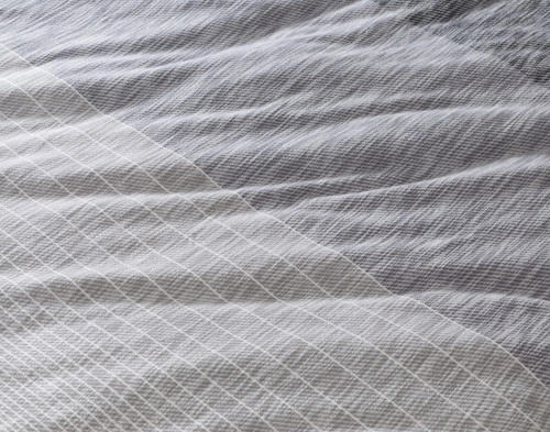 Close-up of the tonal grey stripes on the surface of our Halston Duvet Cover.