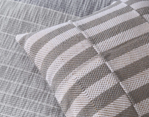 Close-up of the tonal grey and white stripes on our Halston Square Cushion Cover.