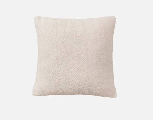 Front view of the soft, textured surface on our Ripple Boucle Square Cushion in Cream on a white background.