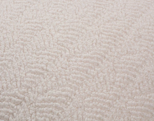 Close-up of the subtle rippling pattern on our Ripple Boucle Square Cushion in Cream.