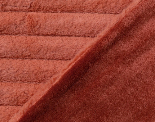 Folded edge on our Red Cedar Channel Plush Throw to show its striped surface and solid velvet backing.