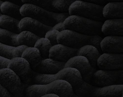 Close-up on the ruffled channel fabric on our Black Channel Plush Throw.