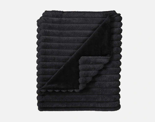 Top view of our Black Channel Plush Throw folded into a tidy square.