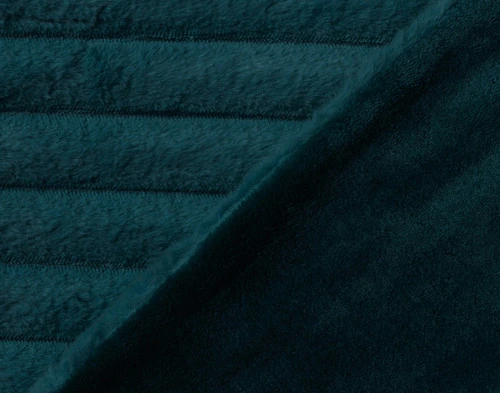 Folded edge on our Deep Sea Channel Plush Throw to show its striped surface and solid velvet backing.