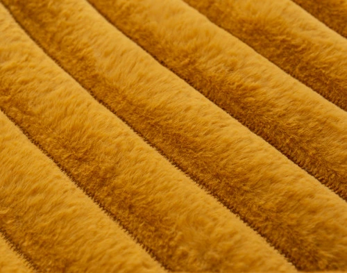 Close-up of the straightened textural stripes on our Goldfinch Channel Plush Throw.