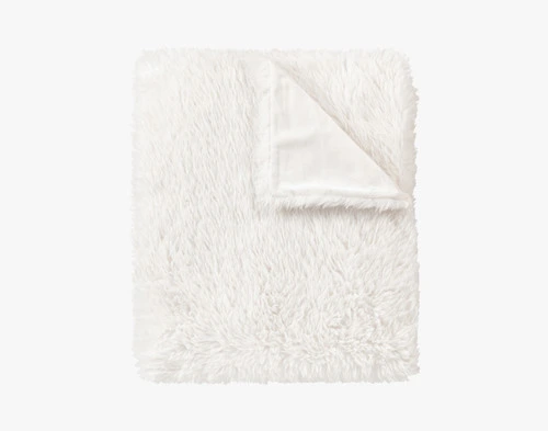 Close-up of the folded corner on our White Soft Mink Throw to show its smooth underside and fluffy surface.