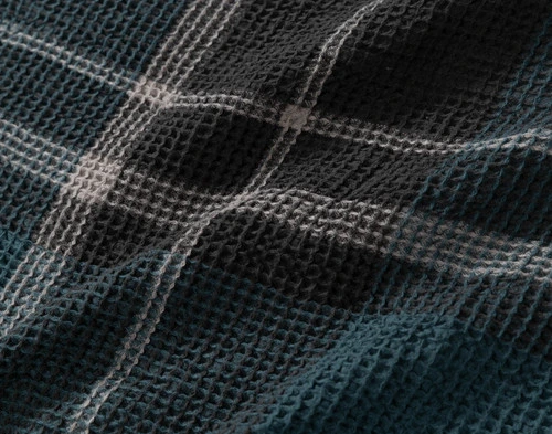 Close-up of the smooth gridline pattern on the reverse side of over our Marlon Duvet Cover.