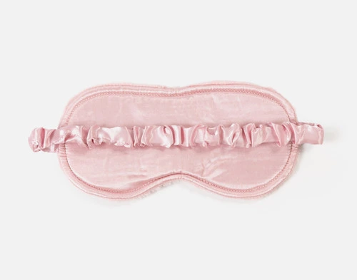 Reverse view of the smooth surface on the sleep mask from our Travel Mate Set in Blush.