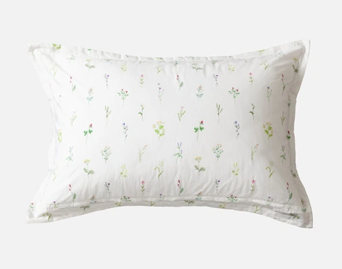 The Lena Pillow Sham reverse design with smaller colourful watercolour flowers in a repeat print.