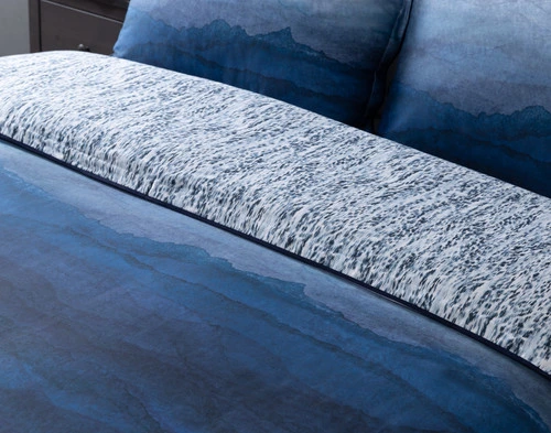 Close view of our Pacifica Duvet Cover folded to show its surface and reverse together.