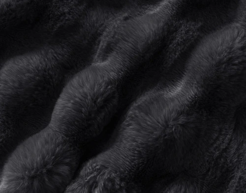 Close-up on the textural surface on our Bubble Faux Fur Throw in Soot.