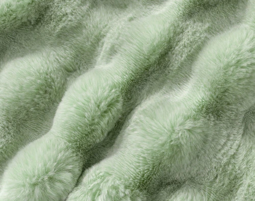 Close-up on the textural surface on our Green Bubble Faux Fur Throw.