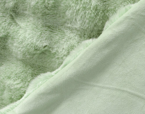 Folded side of our Green Bubble Faux Fur Throw to show its smooth velvet reverse.