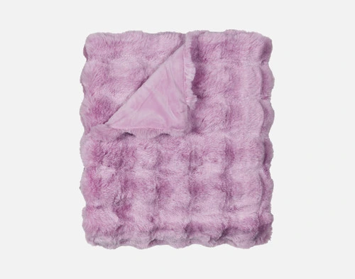 Our Purple Bubble Faux Fur Throw folded into a tidy square against a solid white background.