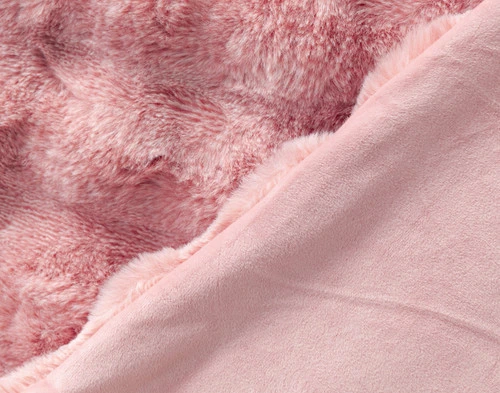 Folded side of our Pink Bubble Faux Fur Throw to show its smooth velvet reverse.