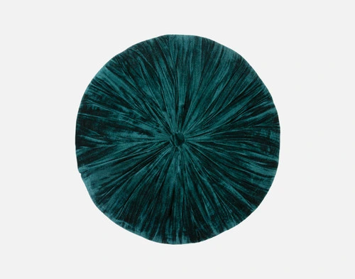 Top view of our Ocean Pleated Velvet Round Cushion sitting on a solid white ground.