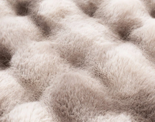 Close-up of the grid-style bubbled texture and faux fur surface on our Marled Bubble Faux Fur Square Cushion.