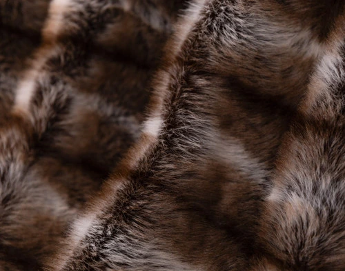 Close-up of the fluffy surface and shifting colours on our Mink Sable Faux Fur Throw.