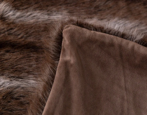 Close-up of the folded corner on our Mink Sable Faux Fur Throw to show its smooth velvet reverse.