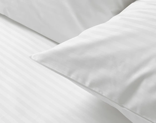 Close-up on the corner of our Striped White Cotton Percale Blend Pillowcase.