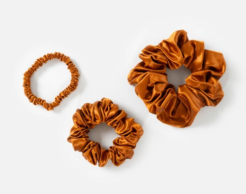 Top view of the small, medium and large scrunchies in our Orange Mulberry Silk Scrunchie Set.