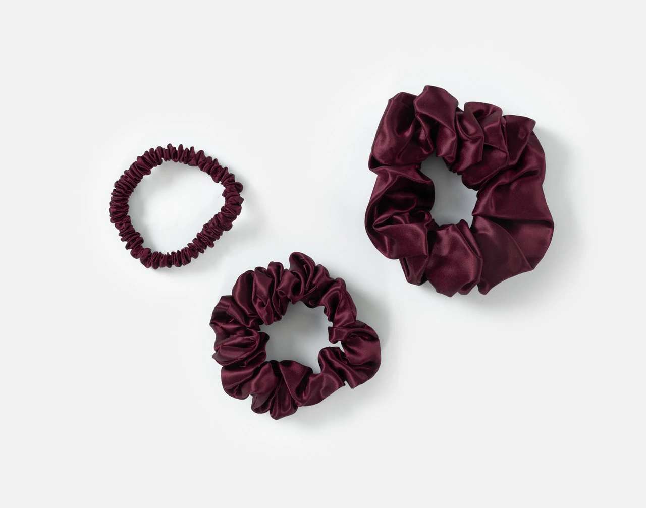 Top view of the small, medium and large scrunchies in our Purple Mulberry Silk Scrunchie Set.