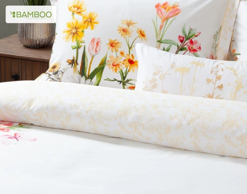 Our Corsage Duvet Cover and matching Pillow Shams and Boudoir Pillow dressing the head of a queen bed.