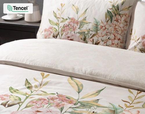 Close up side angle of our Positano designer collection at the head of a bed, featuring the floral pillow shams.