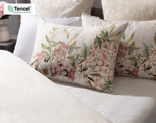 Our Positano Floral Pillow Shams dressing the head of a bed dressed in the Positano Duvet Cover.