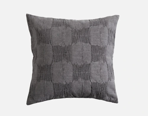 Front view of our Mazama Square Cushion Cover sitting in front of a solid white backdrop.