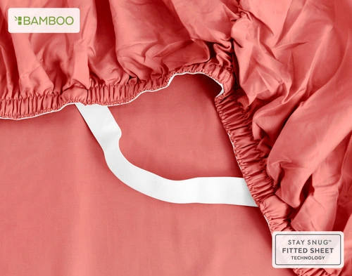 The corner of our Bamboo Cotton Fitted Sheet in Huckleberry, showing the Snug Fit elastic that helps to secure it to your bed.