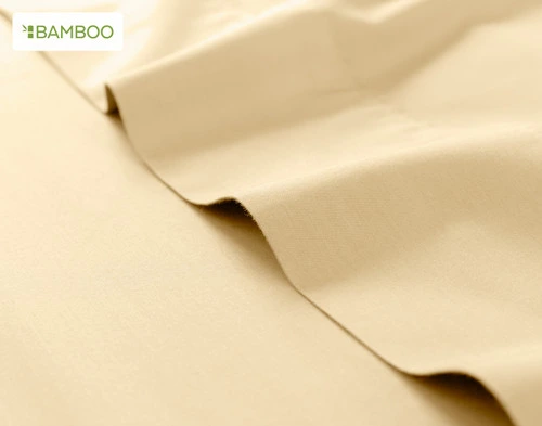 Flat sheet for our Bamboo Cotton Sheet Set in Huckleberry ruffled lightly over a matching smooth surface.